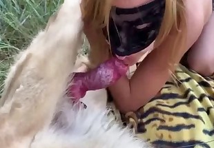 Masked zoophile is sucking a hard dog cock