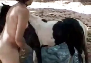 Sexy woman is sucking a pony dick with pleasure