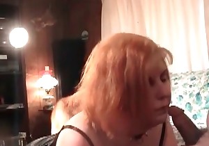 Redhead bitch gives a good blowjob by her dog 